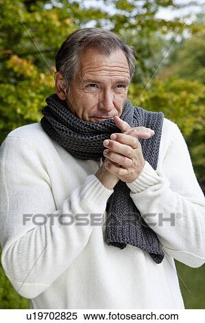 Middle aged man freezing View Large Photo Image Stock Photography - Middle aged man freezing. Fotosearch