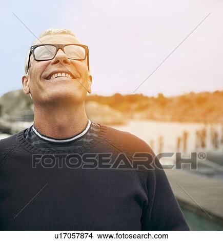 Middle aged man, portrait with flare View Large Photo Image Picture - Middle aged man, portrait with flare. Fotosearch