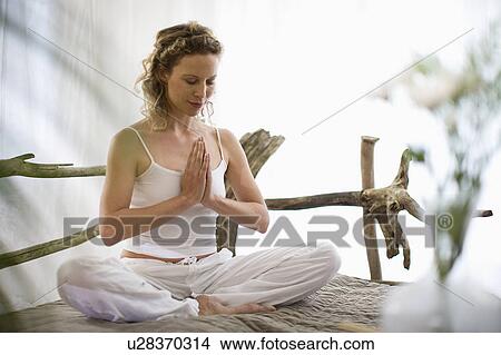 middle-aged woman doing yoga View Large Photo Image Picture - middle-aged woman doing yoga. Fotosearch