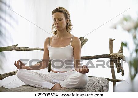 middle-aged woman doing yoga View Large Photo Image Picture - middle-aged woman doing yoga. Fotosearch