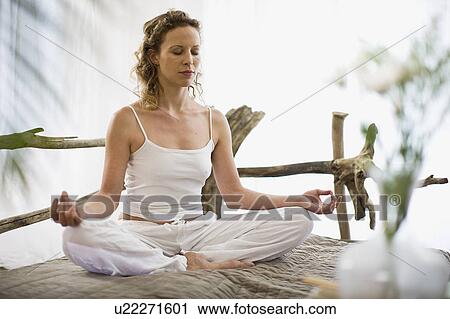 middle-aged woman doing yoga View Large Photo Image Stock Image - middle-aged woman doing yoga. Fotosearch