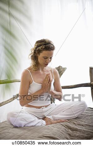 Stock Photography - middle-aged woman doing yoga. Fotosearch