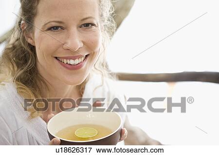 middle-aged woman drinking tea View Large Photo Image Stock Photo - middle-aged woman drinking tea. Fotosearch