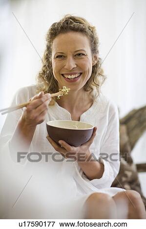 middle-aged woman eating healthy food View Large Photo Image Stock Photo - middle-aged woman eating healthy food. Fotosearch