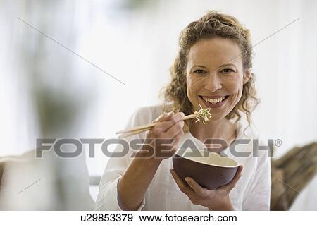 middle-aged woman eating healthy food View Large Photo Image Stock Photo - middle-aged woman eating healthy food. Fotosearch