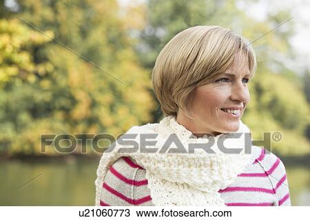 Middle aged woman looking confident View Large Photo Image Stock Image - Middle aged woman looking confident. Fotosearch