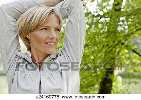 Stock Photo - Middle aged woman looking confident. Fotosearch