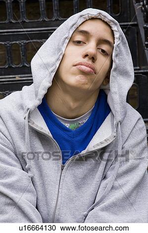 Stock Image - Mixed Race Teenager with Hooded top. Fotosearch