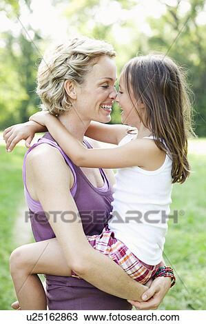 mother and daughter hugging View Large Photo Image Stock Image - mother and daughter hugging. Fotosearch