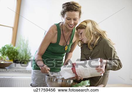 mother and daughter in kitchen View Large Photo Image Stock Photograph - mother and daughter in kitchen. Fotosearch