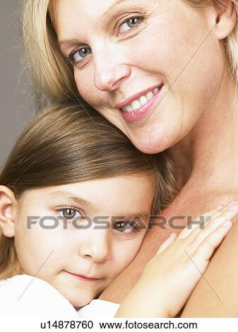 Mother and daughter looking at camera View Large Photo Image Stock Image - Mother and daughter looking at camera. Fotosearch