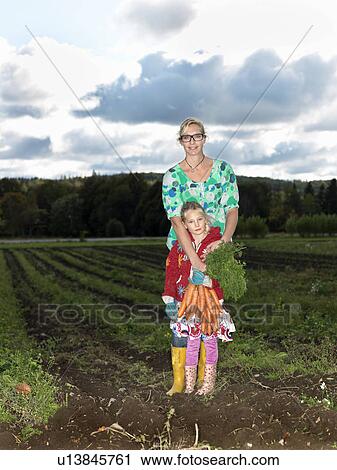 Mother and daughter on field View Large Photo Image Stock Image - Mother and daughter on field. Fotosearch