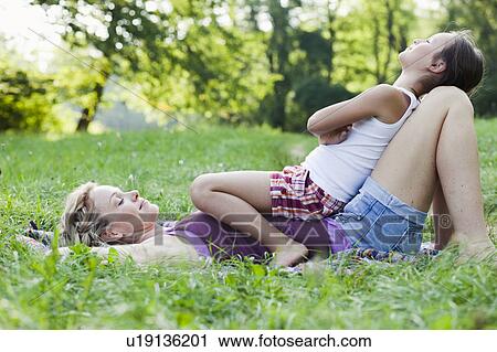 Stock Image - mother and daughter playing. Fotosearch