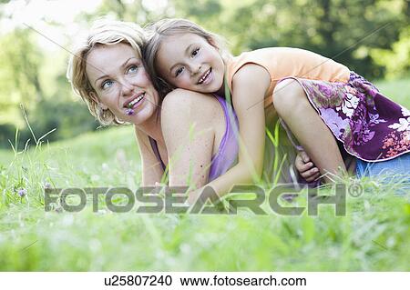 Stock Image - mother and daughter playing. Fotosearch
