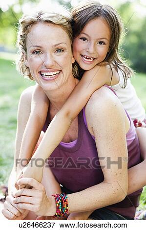 Stock Photo - mother and daughter playing. Fotosearch