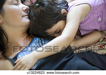 Mother and daughter sleeping View Large Photo Image Stock Image - Mother and daughter sleeping. Fotosearch