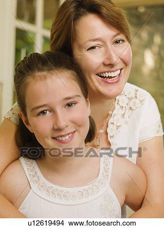 Mother and daughter smile at the camera View Large Photo Image Picture - Mother and daughter smile at the camera. Fotosearch