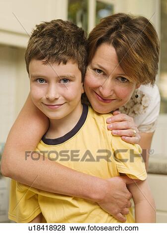 Stock Photo - Mother and daughter smile at the camera. Fotosearch