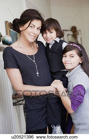 Stock Photograph - mother and her children smiling. Fotosearch