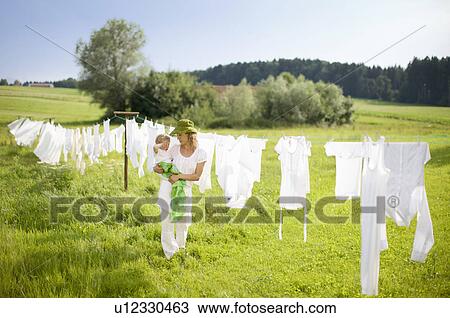 Stock Image - mother and little child. Fotosearch