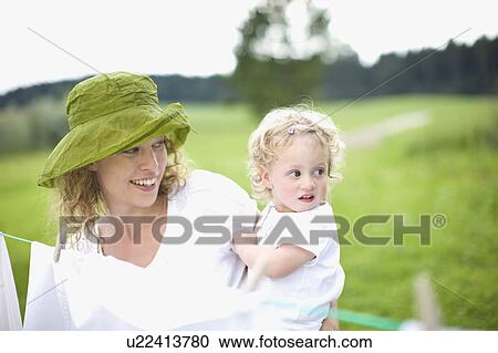 Stock Image - mother and little child. Fotosearch
