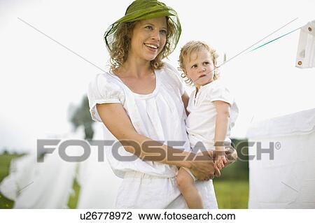 Stock Image - mother and little child. Fotosearch