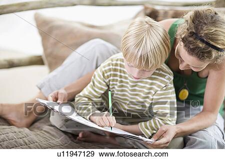Stock Photo - mother and son are painting. Fotosearch