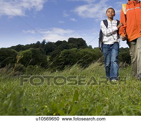 Stock Image - mother and son hiking. Fotosearch