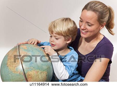 mother and son study globe View Large Photo Image Picture - mother and son study globe. Fotosearch