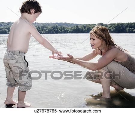 Mother encouraging Child View Large Photo Image Stock Photography - Mother encouraging Child. Fotosearch
