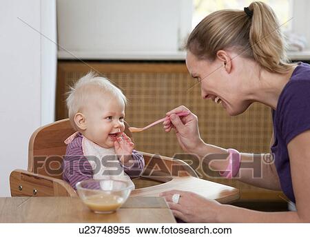 mother feeding baby View Large Photo Image Stock Photography - mother feeding baby. Fotosearch