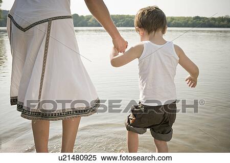 Mother holding child's hand View Large Photo Image Stock Photography - Mother holding child's hand. Fotosearch