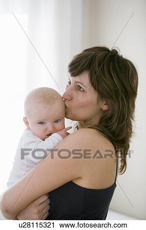 mother kissing baby View Large Photo Image Stock Image - mother kissing baby. Fotosearch