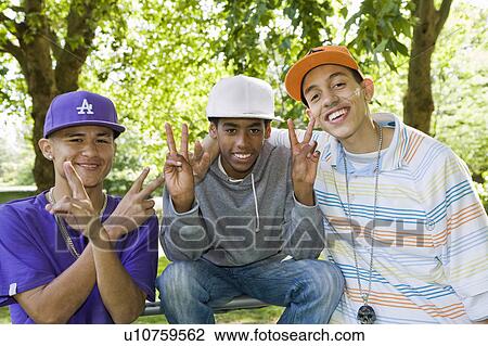 Multi cultural Teenagers in a park View Large Photo Image Stock Image - Multi cultural Teenagers in a park. Fotosearch