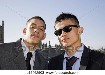 Stock Image - Multi cultural Teenagers in suits. Fotosearch