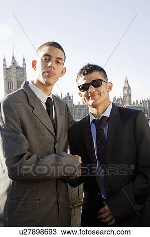 Multi cultural Teenagers in suits View Large Photo Image Stock Image - Multi cultural Teenagers in suits. Fotosearch
