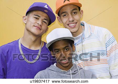 Stock Photo - Multi cultural Teenagers with large caps. Fotosearch