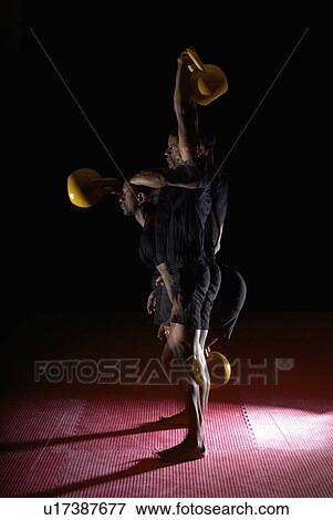 multiple exposure of man and kettle bell View Large Photo Image Stock Photo - multiple exposure of man and kettle bell. Fotosearch