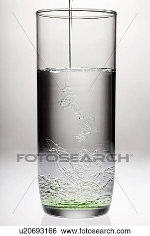 Stock Photograph - Oil pouring into water. Fotosearch