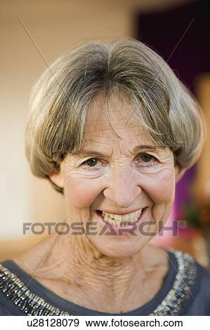 Stock Photo - old woman smiling at viewer. Fotosearch