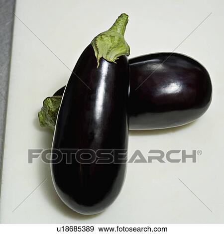 Stock Photo - One Aubergine resting on another. Fotosearch