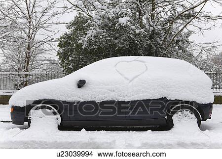 One snow covered car with love heart View Large Photo Image Picture - One snow covered car with love heart. Fotosearch