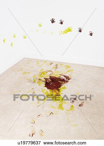 Stock Photo - Paint and hand prints on carpet and wall. Fotosearch