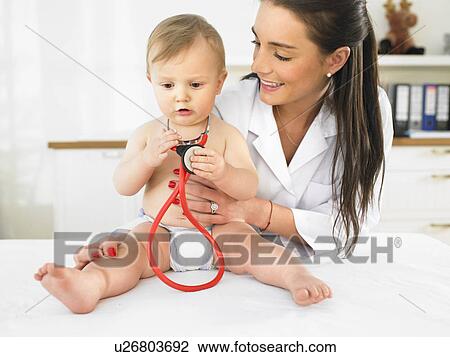 Stock Image - Pediatrician and baby. Fotosearch