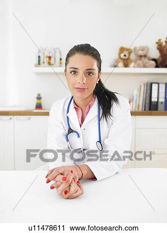 Pediatrician in her surgery View Large Photo Image Stock Image - Pediatrician in her surgery. Fotosearch