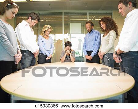 People around a table View Large Photo Image Stock Photograph - People around a table. Fotosearch