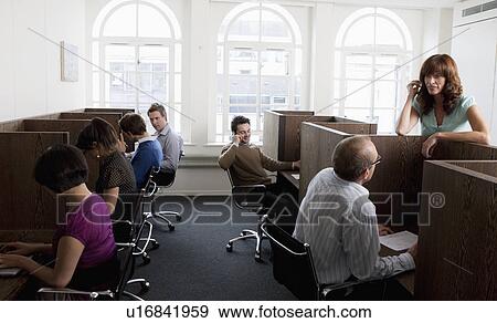 Stock Photo - People at work at workstations. Fotosearch