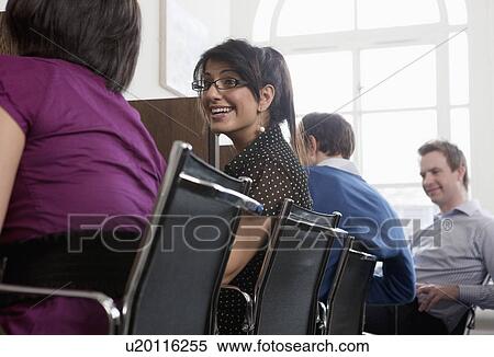 Stock Photography - People at work at workstations. Fotosearch