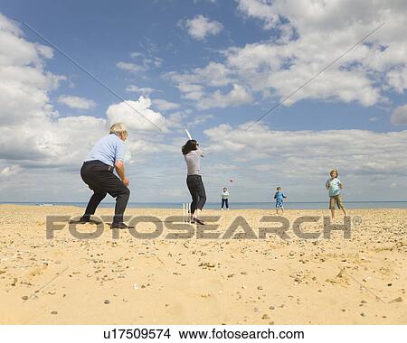 People playing Cricket on a beach View Large Photo Image Picture - People playing Cricket on a beach. Fotosearch
