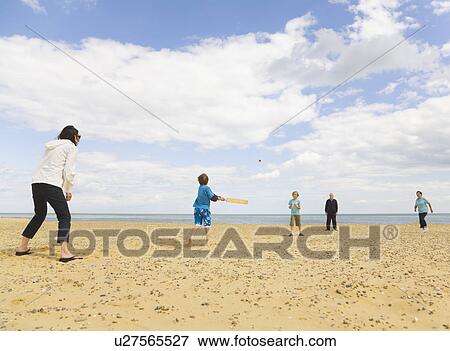 People playing Cricket on a beach View Large Photo Image Stock Photo - People playing Cricket on a beach. Fotosearch